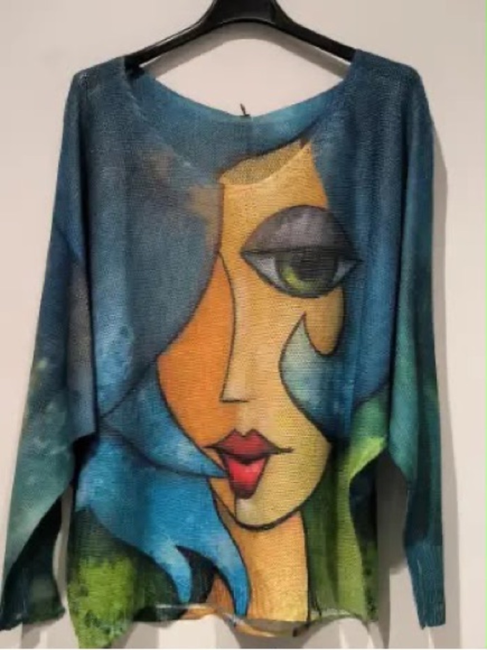 Artistic Blue Portrait Knit Top with Bold Graphic